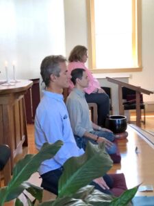 Mark Meditating, Sharon Salzberg in Back